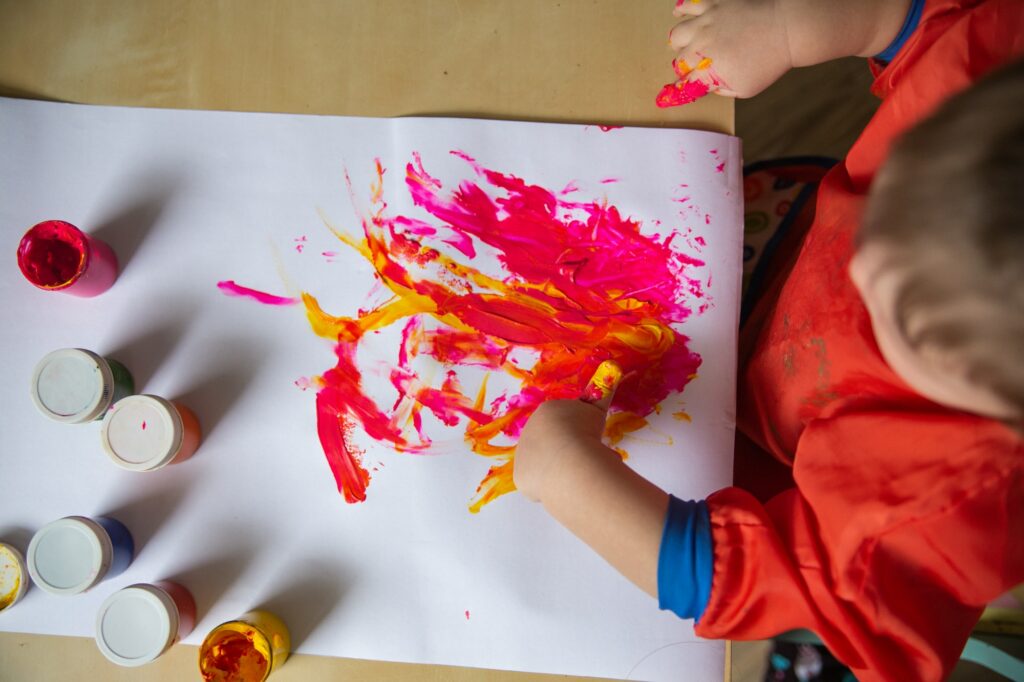 Baby draws with his fingers